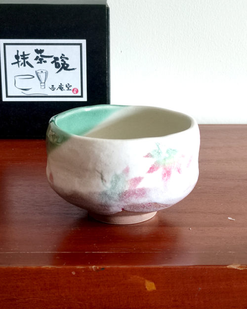 Small Mino Ware Matcha bowl with a cream base and colorful Momiji (Japanese maple leaves) design, handmade in Gifu, Japan. Available at j-okini.com in Malta