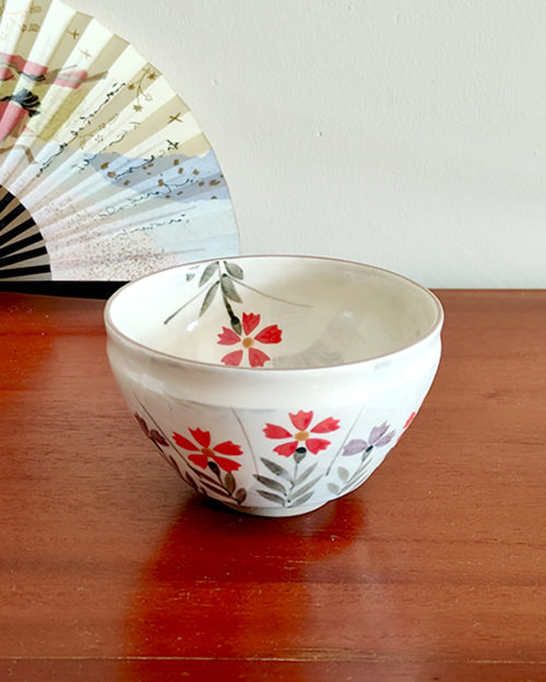 Mino Ware small Matcha bowl with a beige-grey base and colorful Nadeshiko (Dianthus) flower design, handcrafted in Japan. Available at j-okini.com in Malta