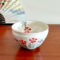 Mino Ware small Matcha bowl with a beige-grey base and colorful Nadeshiko (Dianthus) flower design, handcrafted in Japan. Available at j-okini.com in Malta