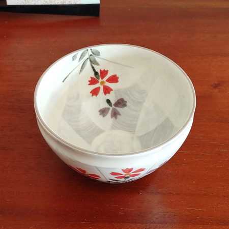 Mino Ware small Matcha bowl with a beige-grey base and colorful Nadeshiko (Dianthus) flower design, handcrafted in Japan. Available at j-okini.com in Malta