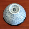 A traditional Japanese Mino ware donburi bowl featuring a deep blue Seigaiha wave pattern. With a 600ml capacity, 16cm diameter, and 8cm height, it's ideal for rice dishes, udon, or instant noodles. Beautifully crafted with a smooth glaze, showcasing the elegance of Japanese ceramics. Made in Japan. Available at j-okini.com in Malta