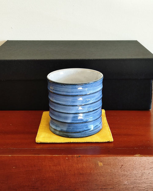 rock glass in blue with a mustard fabric coaster. Made in Japan. Available at j-okini.com in Malta