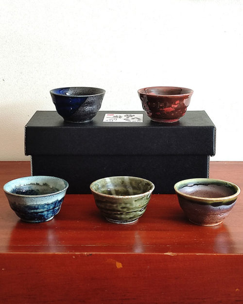 A set of five uniquely glazed Japanese sake cups, each with a different color and finish. Perfect for entertaining or gifting. Made in Japan. Available at j-okini.com in Malta