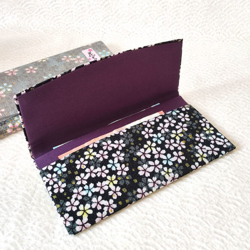 Fold-over chirimen wallet with sakura motifs in black —lightweight, stylish, and made in Japan. Available at j-okini.com in Malta