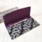 Fold-over chirimen wallet with sakura motifs in black —lightweight, stylish, and made in Japan. Available at j-okini.com in Malta