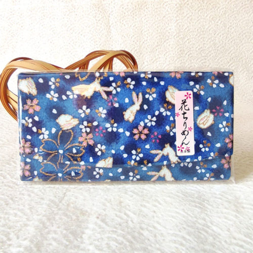 A Hana Chirimen Kimono Wallet with a bunny and sakura pattern, featuring a fold-over design in Blue. Made from Kyoto's traditional Chirimen fabric. Available at j-okini.com in Malta