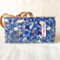 A Hana Chirimen Kimono Wallet with a bunny and sakura pattern, featuring a fold-over design in Blue. Made from Kyoto's traditional Chirimen fabric. Available at j-okini.com in Malta