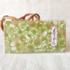 A Hana Chirimen Kimono Wallet with a bunny and sakura pattern in green, featuring a fold-over design. Made from Kyoto's traditional Chirimen fabric. Available at j-okini.com in Malta