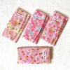 Elegant Japanese kimono wallet with a soft chirimen texture, featuring a unique pink sakura design. Available at j-okini.com in Malta