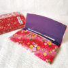 Coral red Chirimen wallet with floral pattern, folded design. Made in Japan. Available at j-okini.com in Malta
